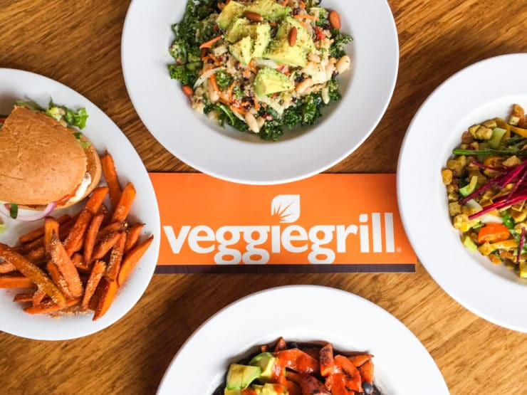 wooden desktop featuring various menu items from veggiegrill